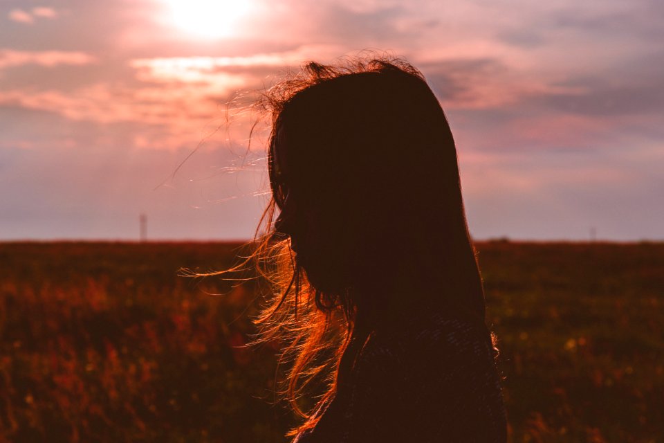 Womans Silhouette Photo During Sunset