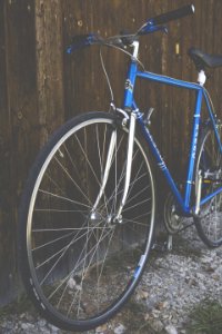 Blue City Bike Beside Brown Wooden Fence photo