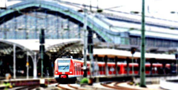 Red Train At A Green Train Station On An Overcast Day photo