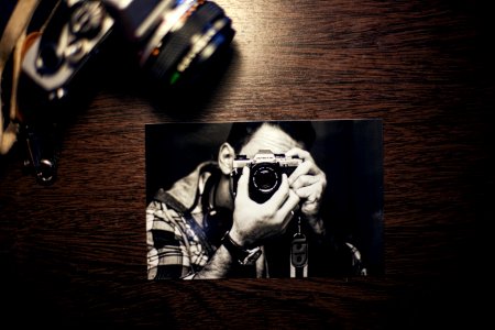Snapshot Of Photographer With Camera photo