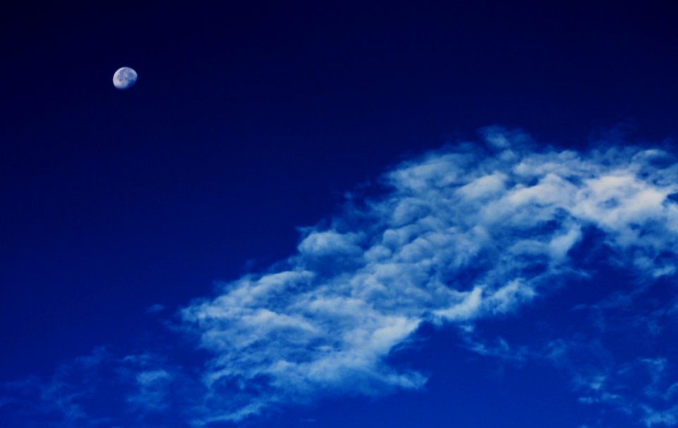 White Clouds Under Blue Sky With Gibbous Moon