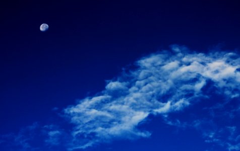 White Clouds Under Blue Sky With Gibbous Moon photo