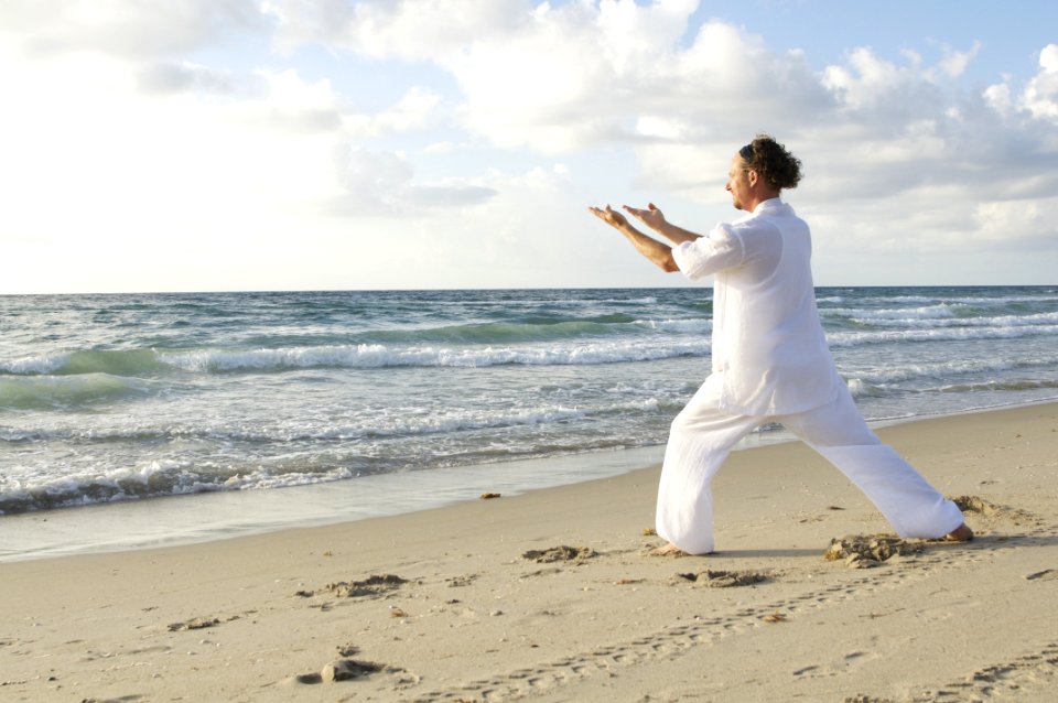 Man Posing On Sea Shore During Daytime