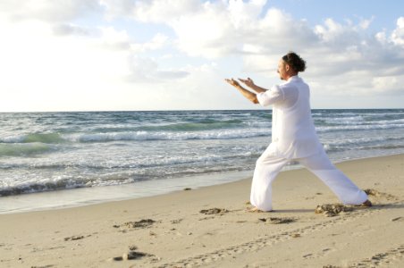 Man Posing On Sea Shore During Daytime photo