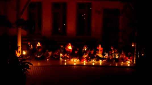 Children Sitting In Candlelight
