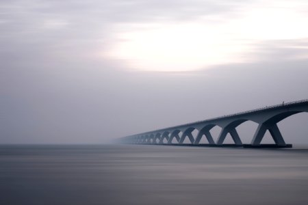 Bridge Over Water In Fog photo