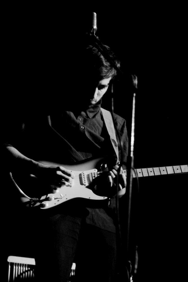 Musician Onstage With Guitar