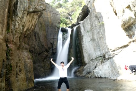 Man In Front Of Waterfall