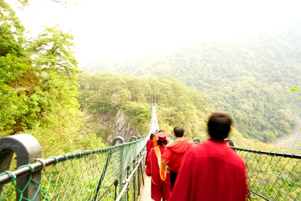 Graduates On Suspension Bridge