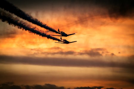 Airplanes In Sky With Smoke Trails photo