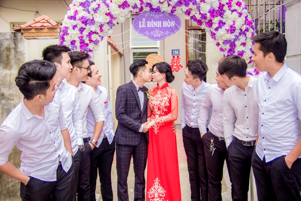 Wedding Couple Under Banner