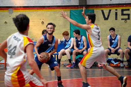 Young Men Playing Basketball
