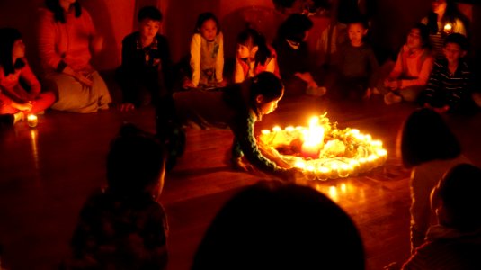 Children In Circle Around Candles
