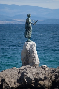 Statue sea coast photo