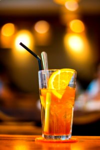 Macro Photography Of Clear Drinking Glass With Lemon Fruit And Black Straw photo