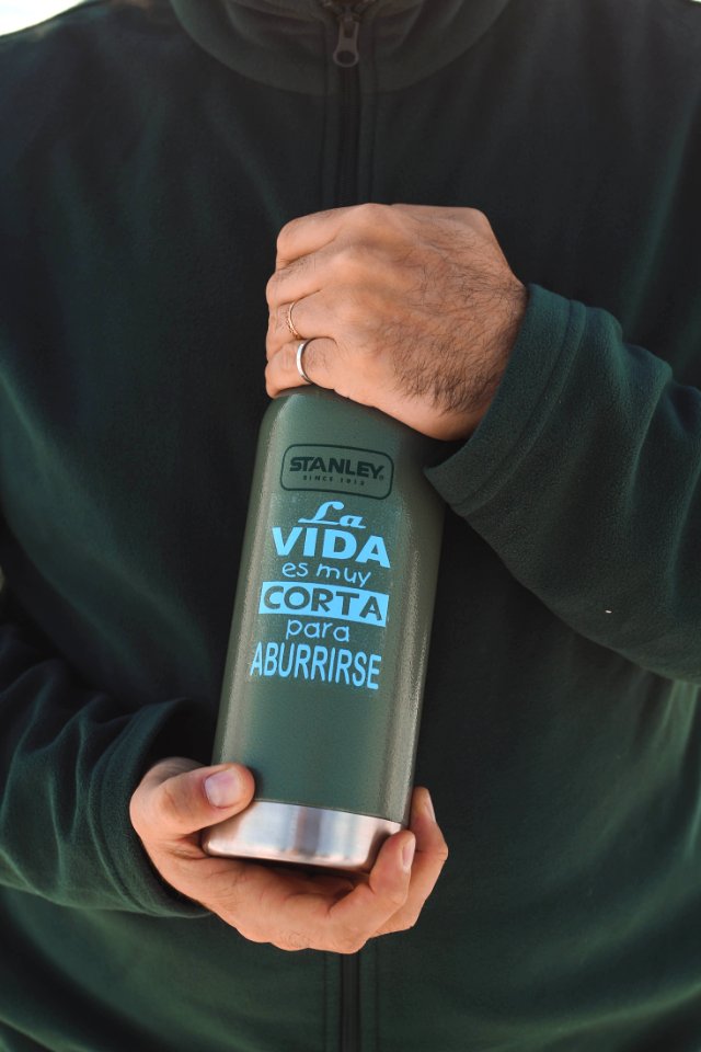 Persons Hand Holding Stanley La Vida Es Muy Corta Para Aburrirse Bottle