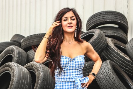 Woman Standing In Front Of Car Tires photo