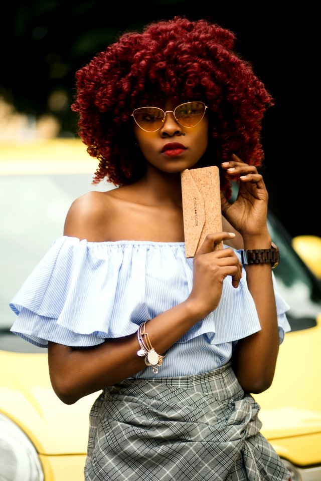 Woman Wearing Gray Off-shoulder Shirt And Sunglasses photo