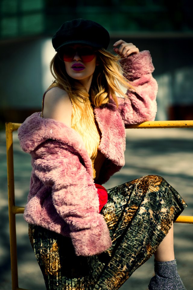 Shallow Focus Photography Of Woman In Pink Sheepskin Coat