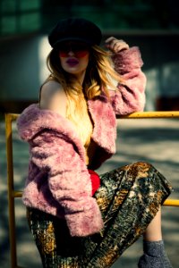 Shallow Focus Photography Of Woman In Pink Sheepskin Coat photo