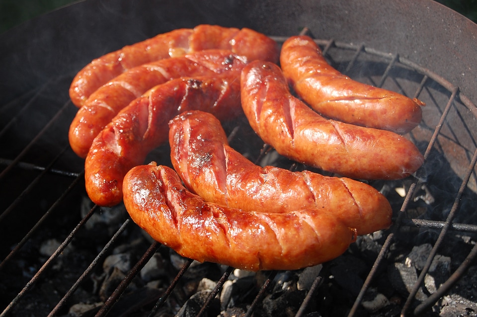 Sausages grill burning