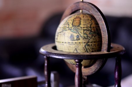 Shallow Focus Photography Of Brown Globe