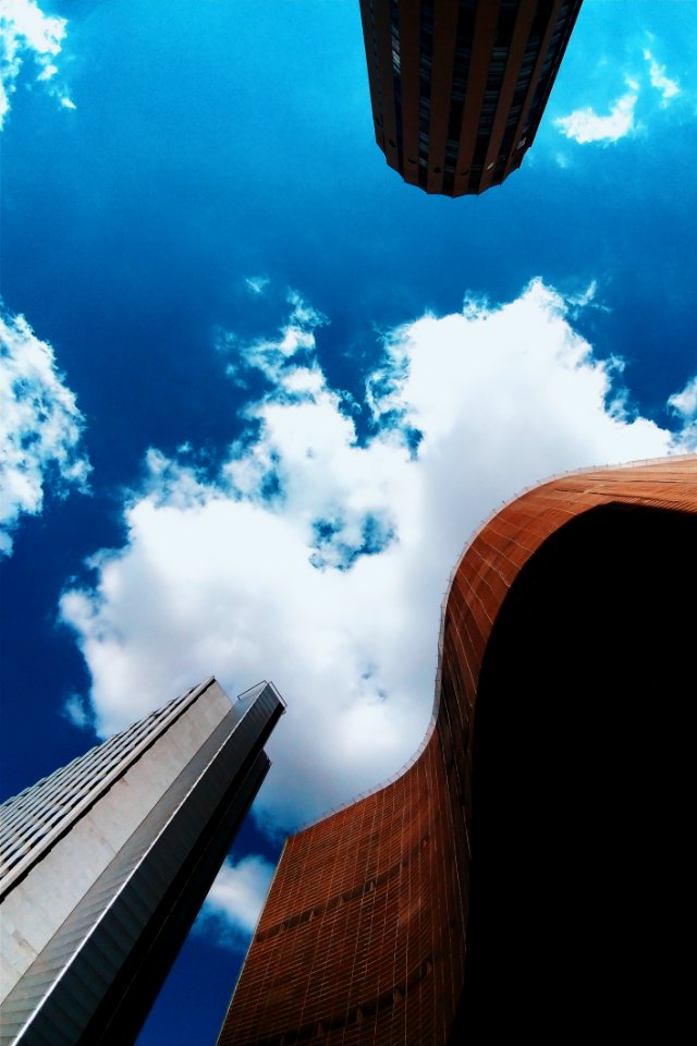 Brown And White Concrete Buildings Under Blue Sky Photography