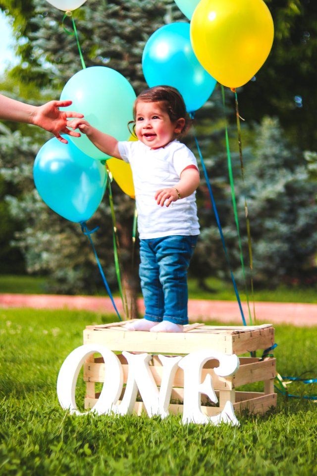 Toddler Standing On Wooden Crate