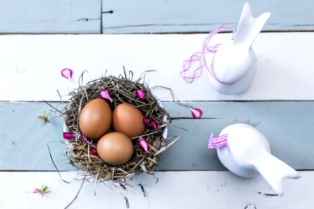 Three Brown Eggs On Nest photo