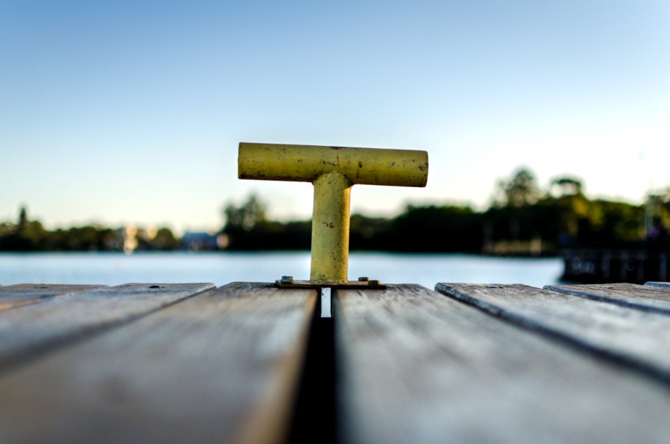 Selective Focus Photo Of Yellow Bollard