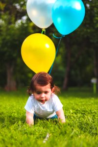 Photography Of A Baby On Grass photo