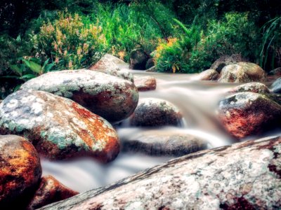 Time Lapse Photo Of River Flowing On Rocks photo