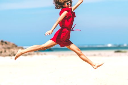 Woman In Red Jumping photo