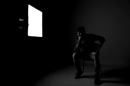 Man Sitting On Chair While Thinking photo