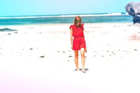 Woman Wearing Red Romper On Beach photo
