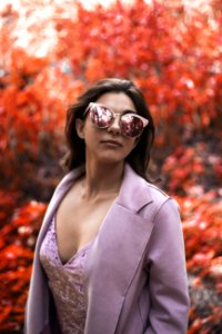Woman Wearing Pink Blazer And Cat-eye Sunglasses photo