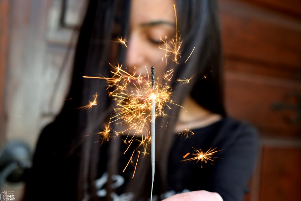 Selective Focus Photo Of Person Holding Sparkler