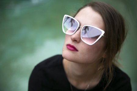 Woman Wearing Gray Framed Butterfly Sunglasses photo