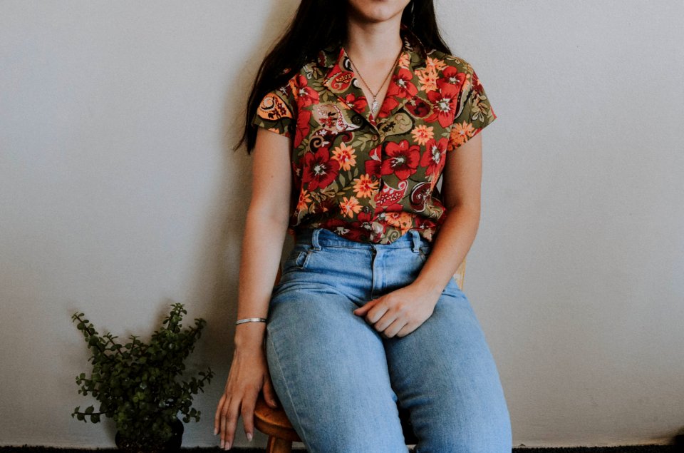 Woman Sitting On Chair Beside Green Plant photo