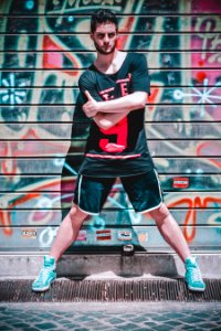 Man Wearing Black Black T-shirt And Black Gym Shorts photo