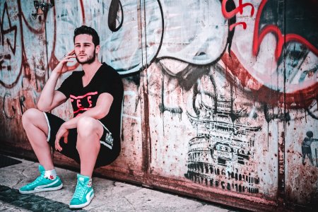 Man Leaning On Wall