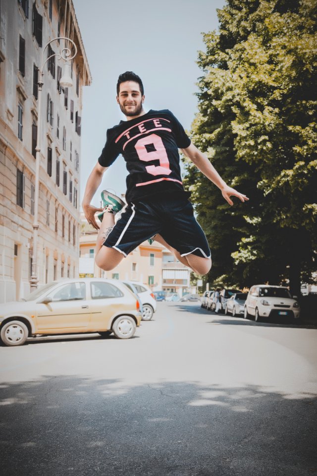 Photo Of A Guy Jumping On Road