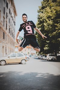 Photo Of A Guy Jumping On Road