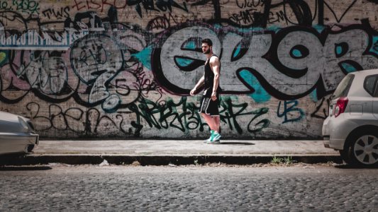Man Standing On Sidewalk
