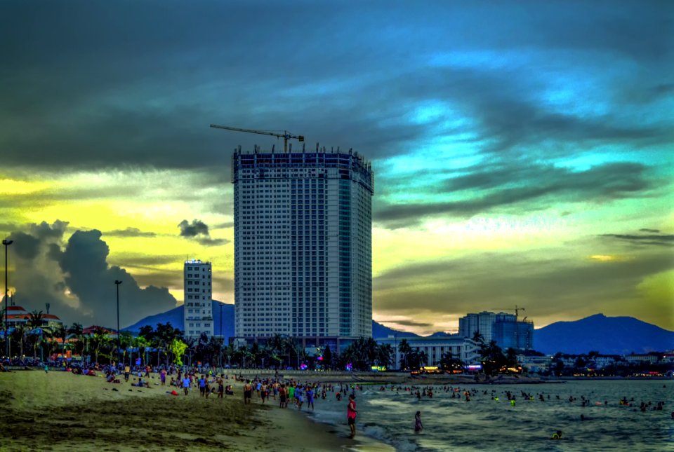 White Concrete High-rise Building Near Sea At Daytime photo