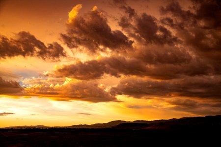 Orange Sunset With Clouds In Sky photo