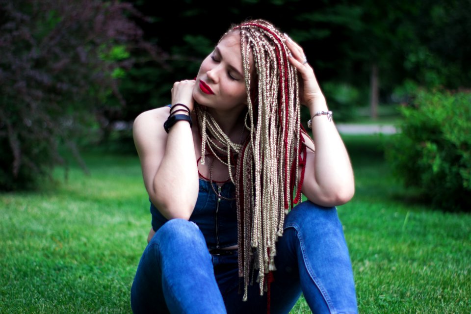 Woman In Blue Sleeveless Top And Blue Jeans