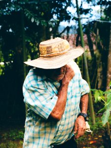 Man Looking Down Wearing Sunhat photo