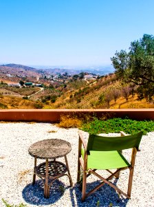 Photo Of Green And Brown Folding Chair Near Wicker Table photo