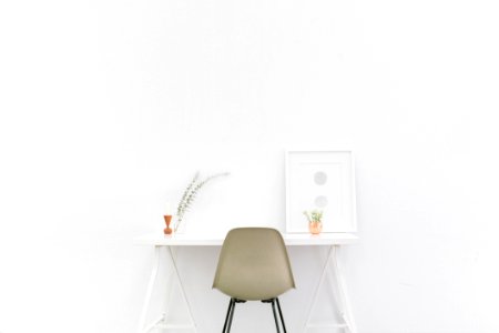 Beige And Black Chair In Front Of White Desk photo